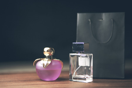 perfume bottles and shopping bagsの写真素材