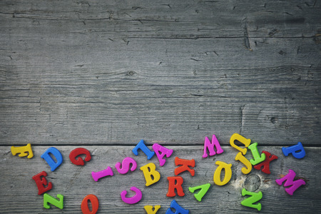 A studio photo of  letters on wooden tableの写真素材