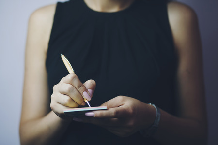 Business woman note something in diaryの写真素材