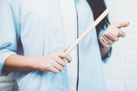 Wood centimeter ruler on woman handの写真素材