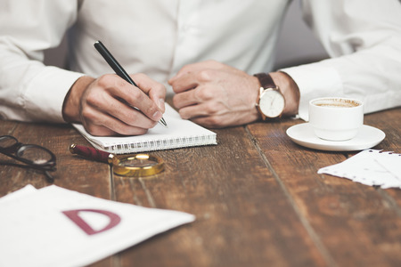 Close-up of a man working at a desk in the office.の写真素材
