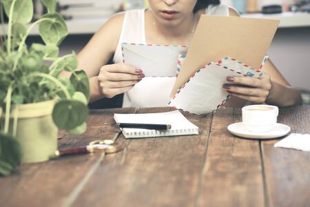 woman hand letter on desktopの写真素材