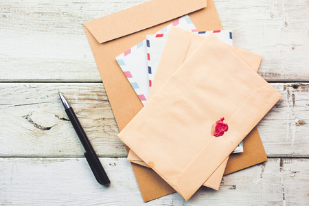 letters  and pen on tableの写真素材