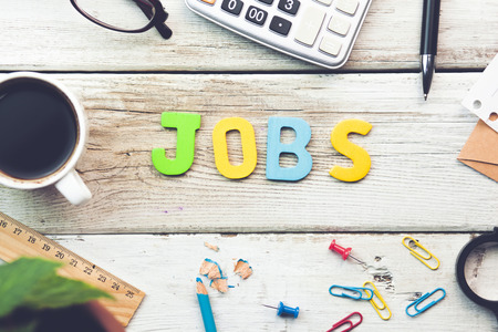 Jobs text on wooden working table