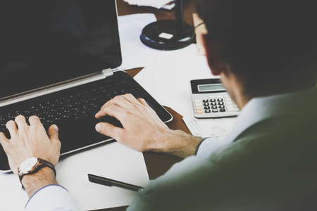 man using the laptop in his officeの写真素材