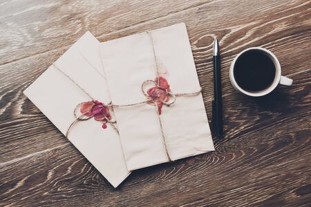 blank letter with the envelope on coffee tableの写真素材