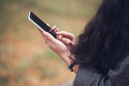 young beautiful woman using smartphone in the cityの写真素材