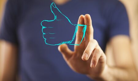 Man palm opening showing thumb upの写真素材