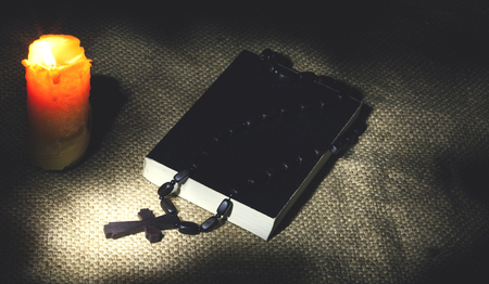 religious theme candle with incense and holy bookの写真素材