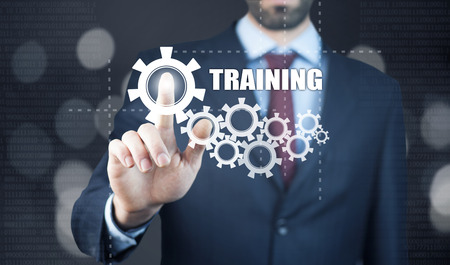 Businessman pressing touch screen interface and select icon trainingの写真素材