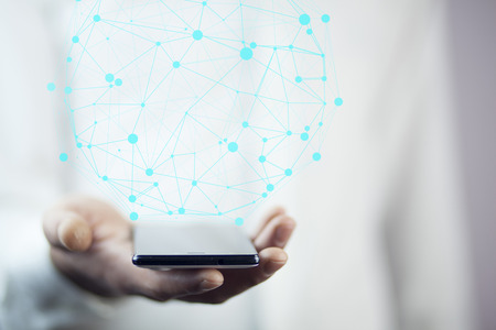 Businessman on blurred background using circle igital data network with mobile phone