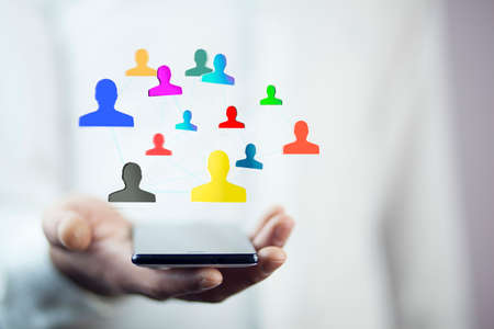Businessman using hand phone with  social network interfaceの写真素材