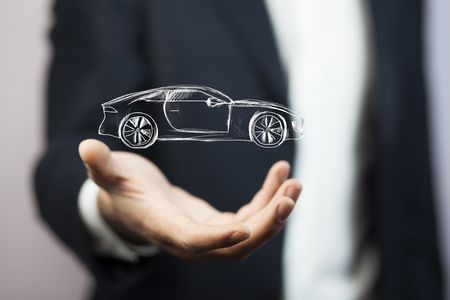 Businessman with giving gesture and icon of car.の写真素材