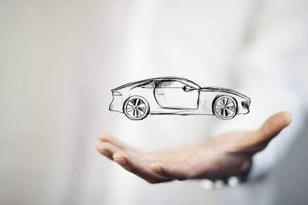 Businessman with giving gesture and icon of car.の写真素材