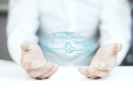 man hand holding car on white backgroundの写真素材