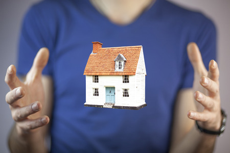 home model  in the business man handの写真素材