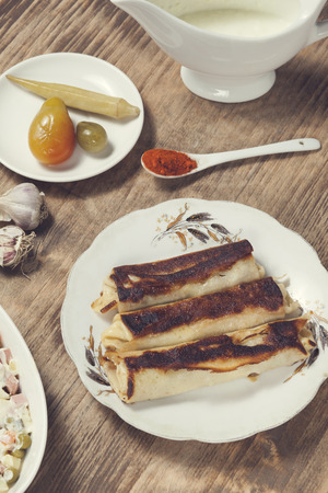 salsalad, pickles and vegetables on the tableの写真素材