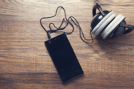 Smart phone with earphone on the tableの写真素材