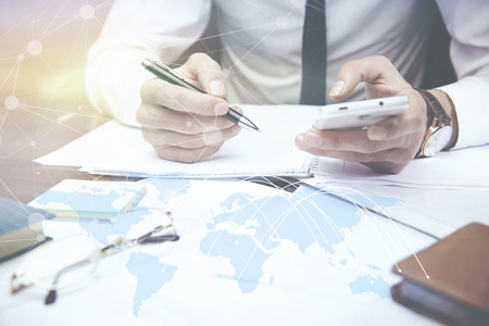 businessman hand working with modern technology and digital layer effect as business strategy conceptの写真素材