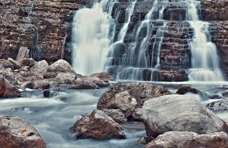 rock stream beautiful waterfall and stones insideの写真素材