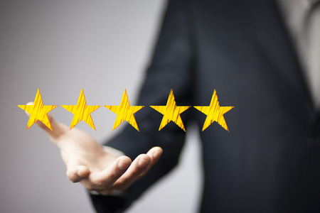 View of a Businessman touching technology interface with ranking stars