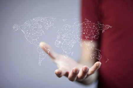 businessman touching a world map on the screenの写真素材