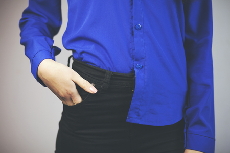 model in black trousers and blue blouseの写真素材
