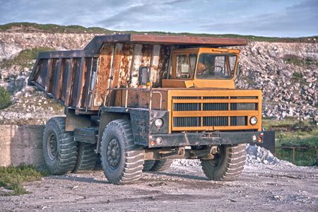 Heavy mining truck driving through the iron ore opencastの写真素材