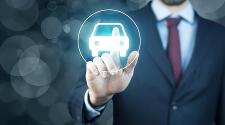 man hand car in  screen in bokeh backgroundの写真素材