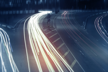 Long exposure photo of traffic with blurred traces from cars