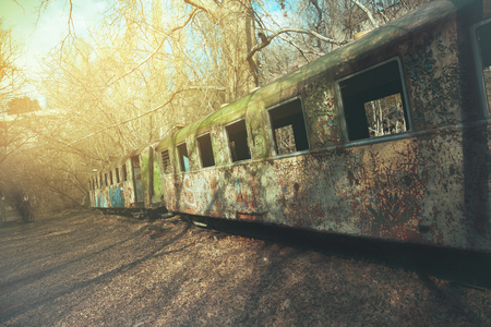 Old rusty steam locomotive under the sunny sky