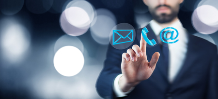 man choosing mail as a contact method on bokeh backgroundの写真素材