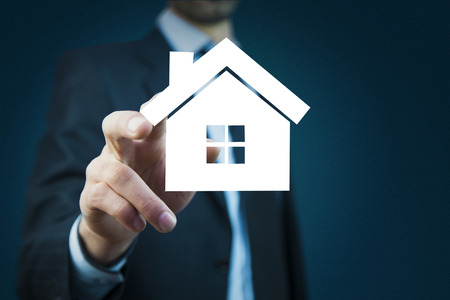 man hand  house on  virtual screenの写真素材