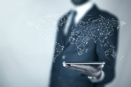 
Businessman hand phone with  map of world wide on screenの写真素材