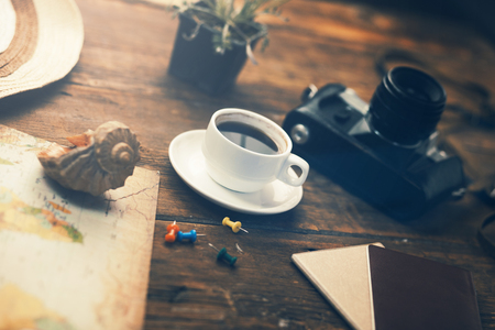Travel and vacation items on wooden tableの写真素材