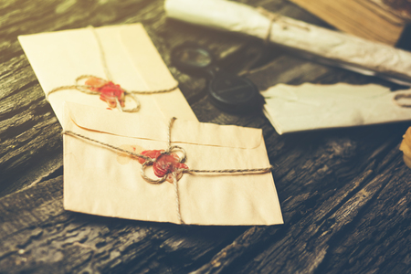 letters on the brown wooden table backgroundの写真素材