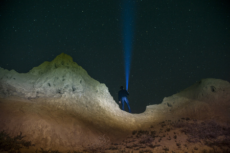 Lighting Up the Night over man in star sky