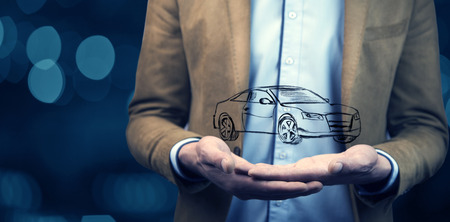 man hand car in screen in officeの写真素材