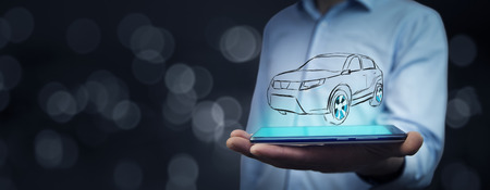 man  hand  phone with car icon on virtual screen.の写真素材