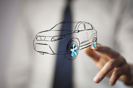 Male hand presenting car icon on virtual screen.の写真素材