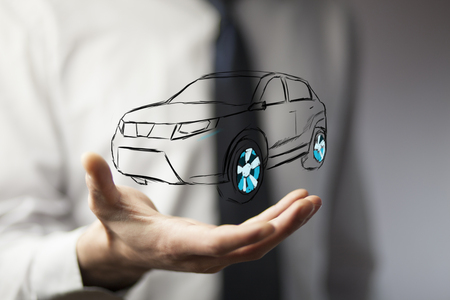 Male hand presenting car icon on virtual screen.の写真素材