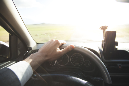 young business man in suit driving carの写真素材