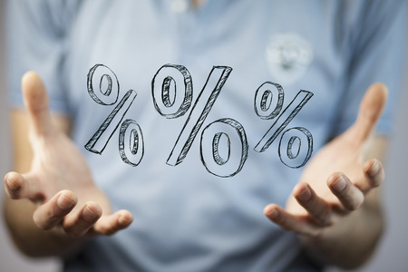 man  holding  percents icon in the screen