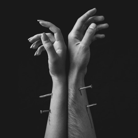 Male and female hand are tied togetherの写真素材
