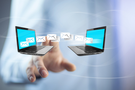 Man hand with notebooks and correspondence in screenの写真素材