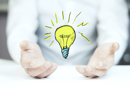 business man hand idea with light bulbの写真素材