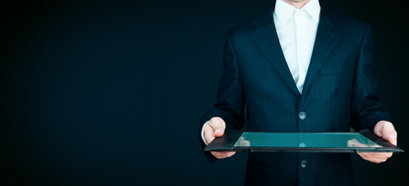 Asian business man using digital tablet computerの写真素材