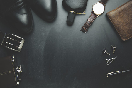 man elegant  and different accessorise on black backgroundの写真素材