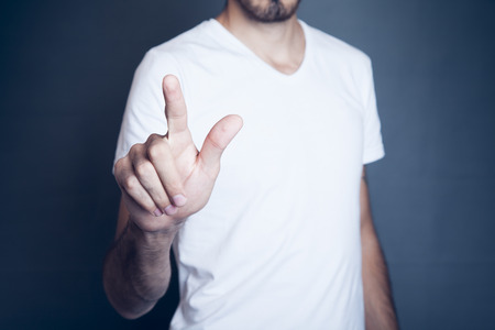 Man touching on a touch screen interfaceの写真素材