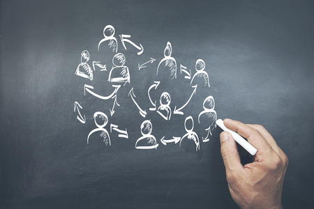 man hand  chelk drowing  partnership in  boardの写真素材